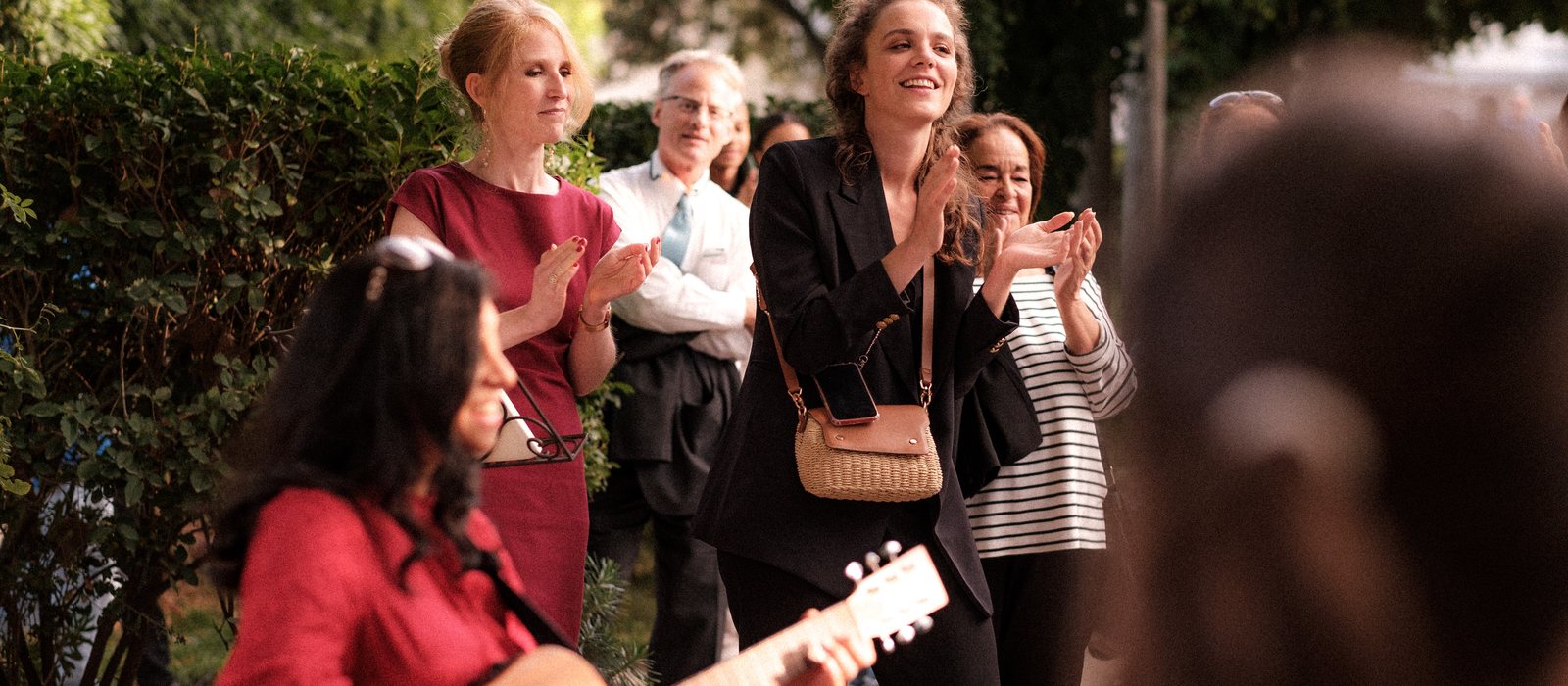 Guests applauding after a song